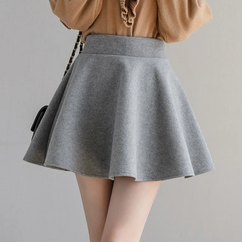 Faldas plisadas de PU de Color sólido para mujer, minifalda de cuero con cremallera única de cintura alta ajustada para invierno, moda de otoño