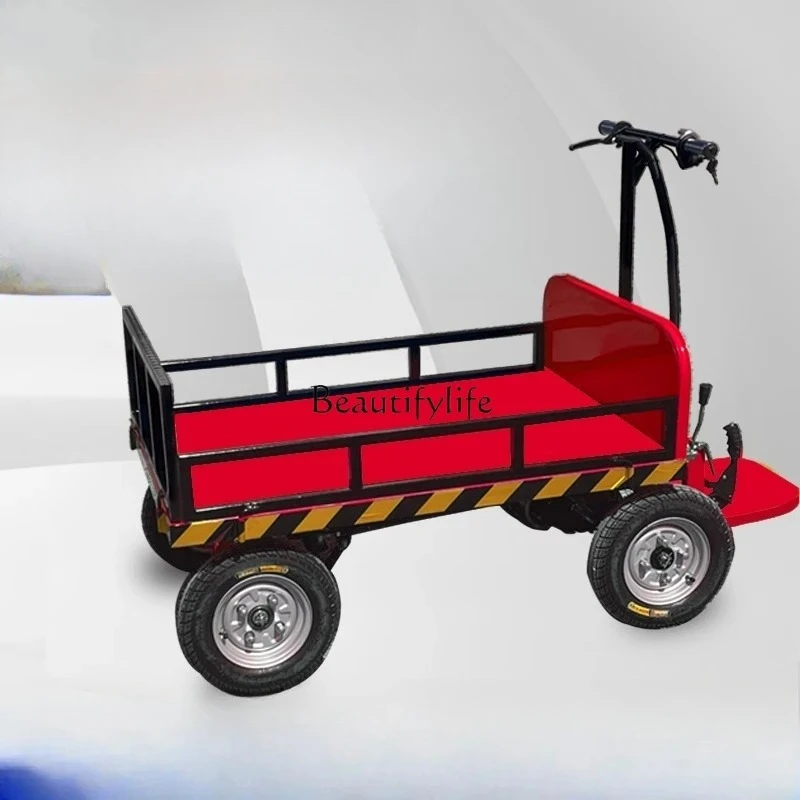 

Small electric station driving flat truck truck construction site pulling bricks and cargo load transportation
