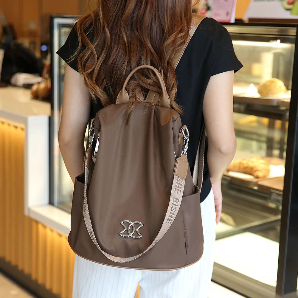 حقيبة ظهر نسائية 2024 جديدة خفيفة الوزن مقاومة للماء بسعة كبيرة متعددة الوظائف كاجوال أسهل لمباراة حقيبة سفر حقيبة ظهر مدرسية #1