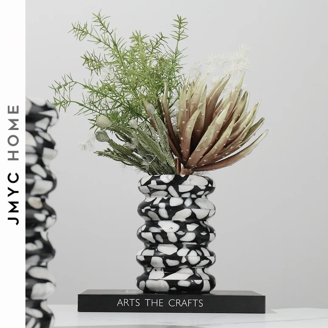 Layered marble vase like living room tabletop flower arrangement with simple decoration