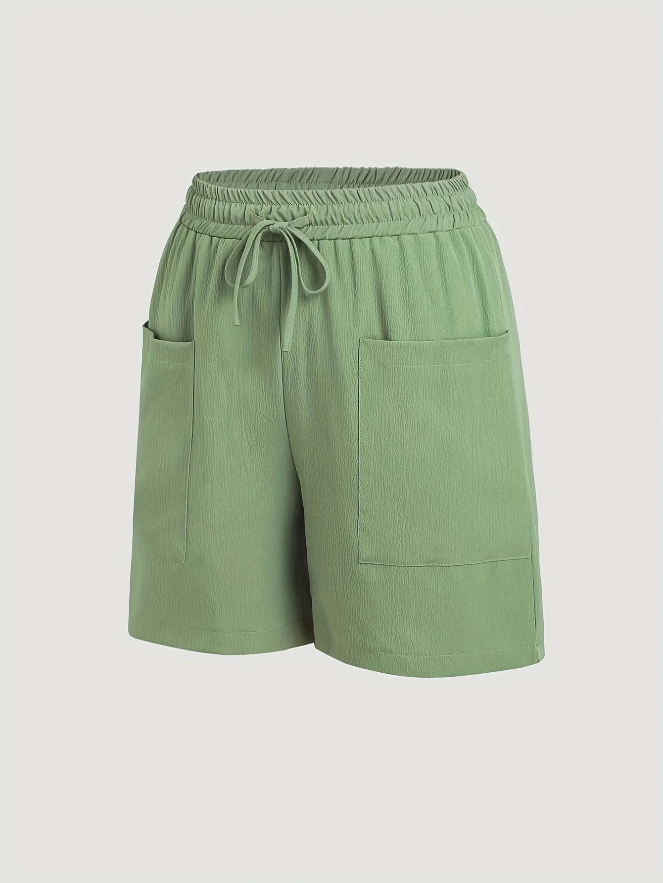 A 2-piece set of solid color casual drawstring shorts with pocket beach pants for women in 2026