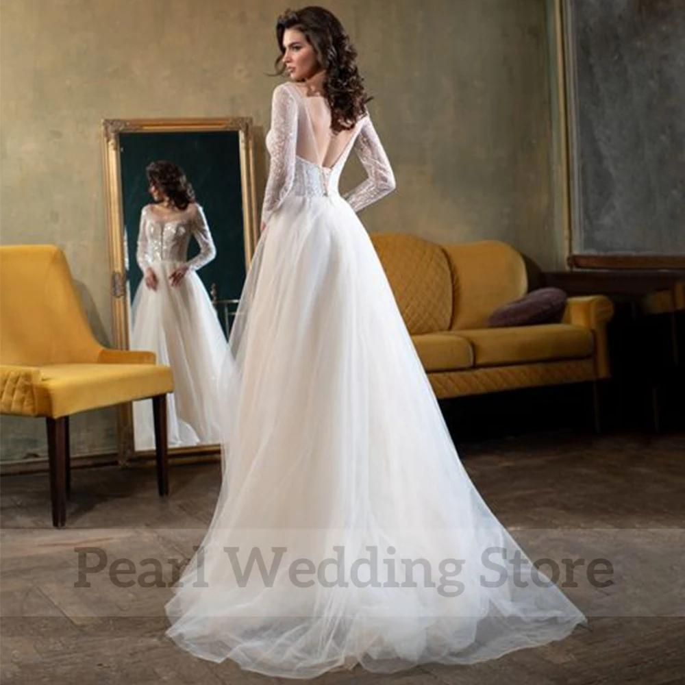 Scoop Hals Lange Mouw Trouwjurk Sexy Tulle Illusion Kralen A-lijn Robe De Mariee Bridal Backless Robe Gown فستان الزفاف