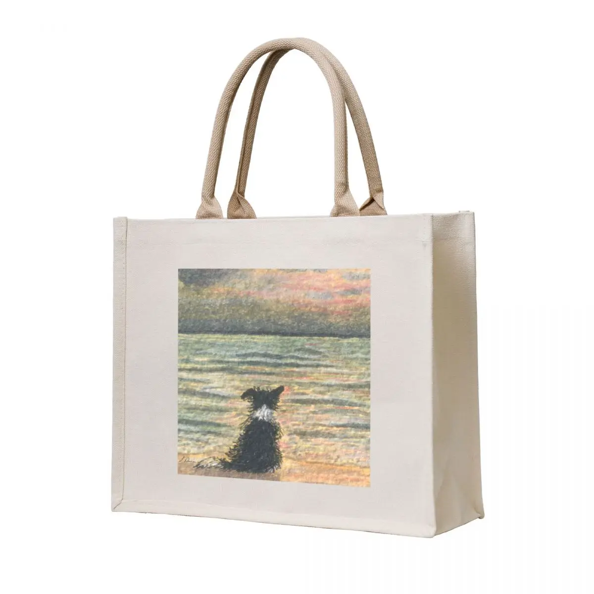 

A Border collie dog gazes out over the ocean watching the sun come up, greeting the morning Tote Bag tote bag Women's shopper