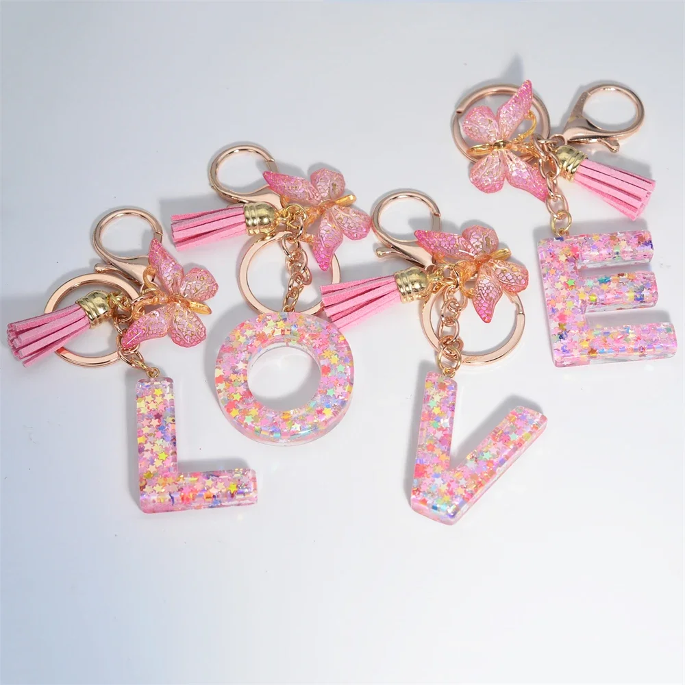 Porte-clés pendentif lettre initiale pour femme, pompon, papillon rose, porte-clés mignon, portefeuille de voiture, sacs à main, ornements de sac à dos