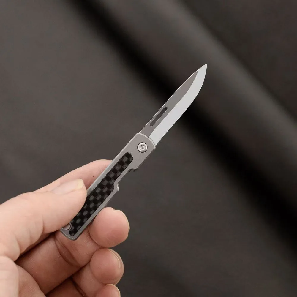 Titanium alloy mini EDC folding knife keychain for unboxing and express delivery, portable outdoor pocket folding knife