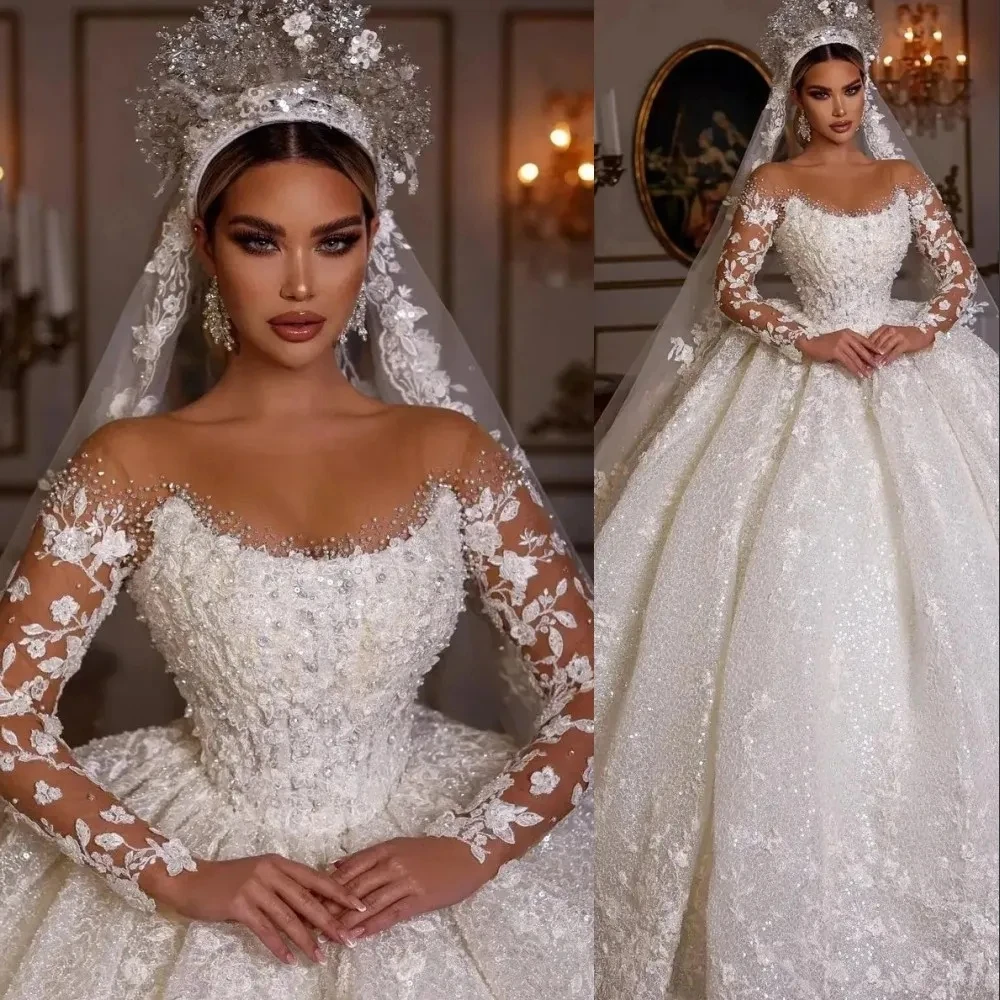 

2025 Ball Gown Wedding Dresses Sequins Lace Crystal Bead Jewel Neck Illusion Long Sleeves Dubai Arabic Bride Bridal Gowns