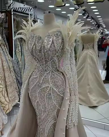 Champagne Long Sleeve Feathers Arabic Dubai Evening Dress 2025 Customized Crystals Pearl Prom Dress Engagement Gowns With Train