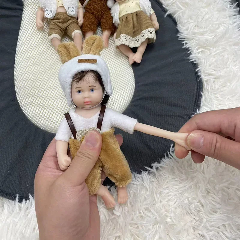 7Inch Full Silicone Reborn Dolls Lifelike Soft Solid Silicone Stretchable Same As The Ppicture Hand-Rooted Black Hair Doll Toy