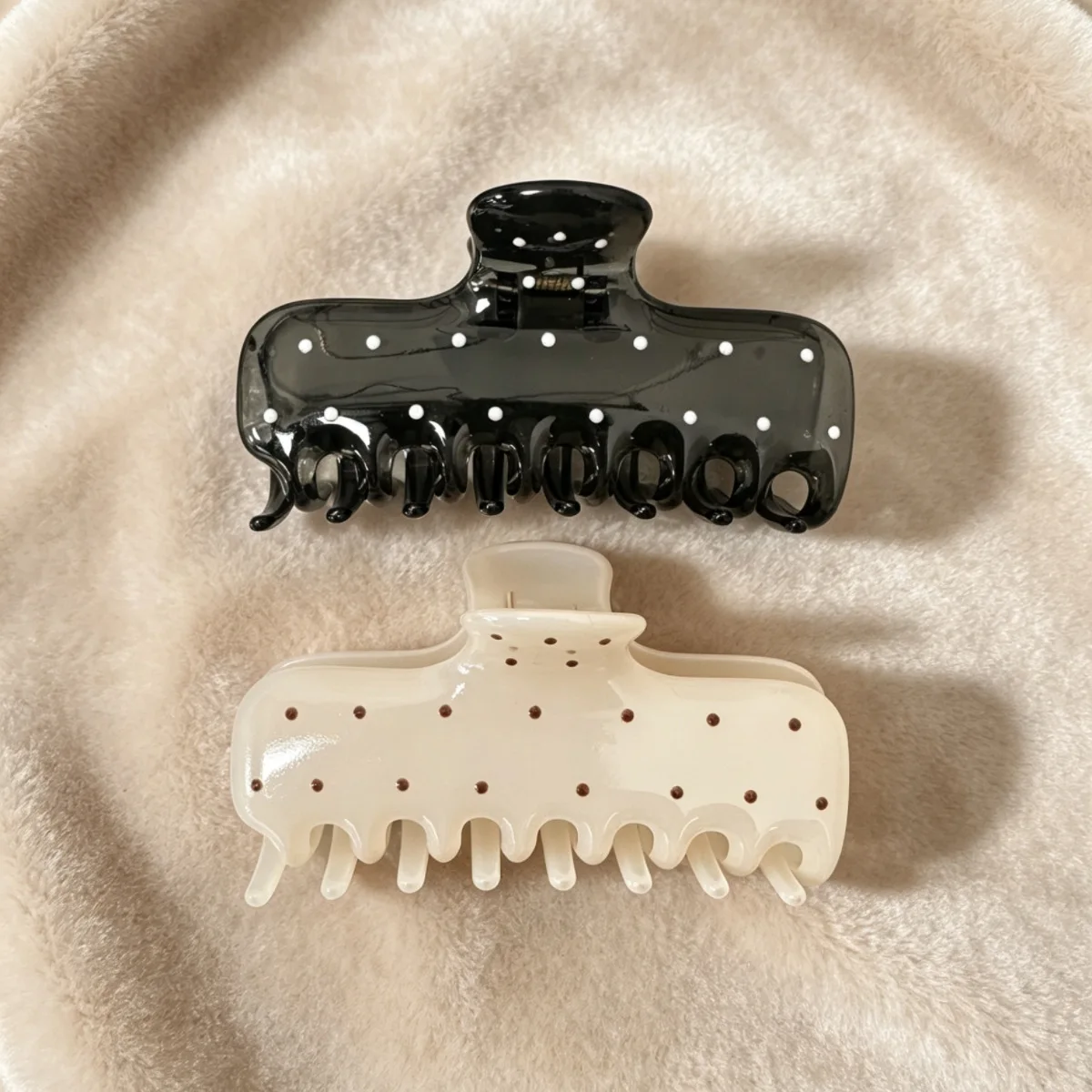 Korean-style large oval cutout claw clip with polka-dot pattern; a minimalist, elegant 