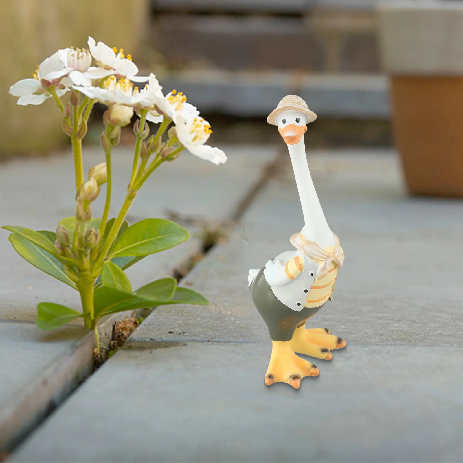 Garden and lawn resin duck figurines designed for outdoor decoration crafted with weather resistant resin and charming design