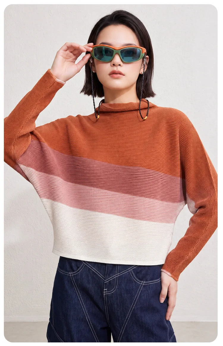 Issey Miyake-style pleated women's top: Autumn print, draped high neck, batwing sleeves, cropped length.