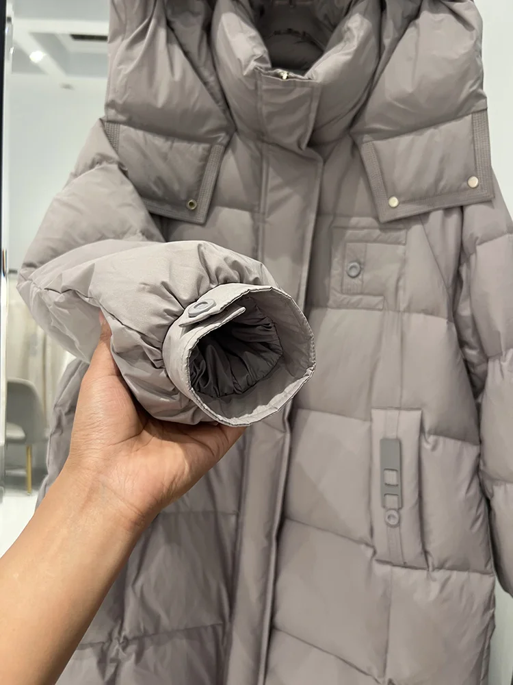 Piumino invernale nuovo da donna medio a lungo edizione coreana felpa con cappuccio alla moda addensata allentata versatile piumino d'anatra bianco