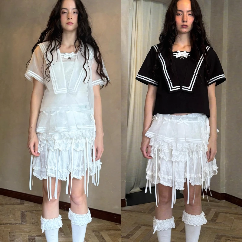 2025 الربيع الصيف الخريف الأبيض القوس لطيف المرأة مطوي تنورة قصيرة التصميم الأصلي الحلو شاش شفاف ضرطة الستار السيدات