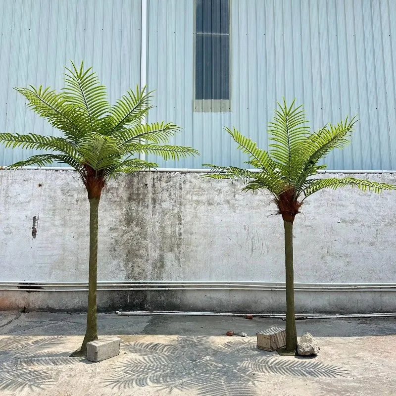 Outdoor artificial palm trees decorating landscapes with green plastic in beach spots and amusement parks