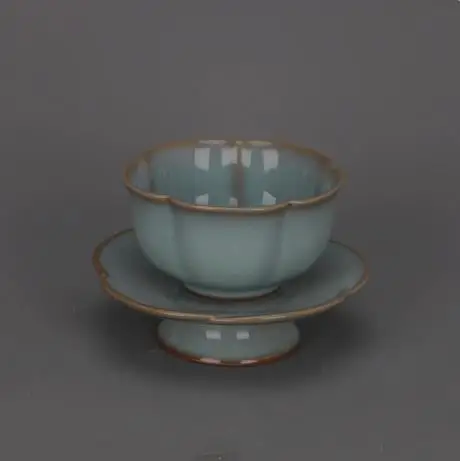 

Antique decorative ornament: Celadon-glazed plum blossom cup and saucer from Ruyao Kiln in the Song Dynasty