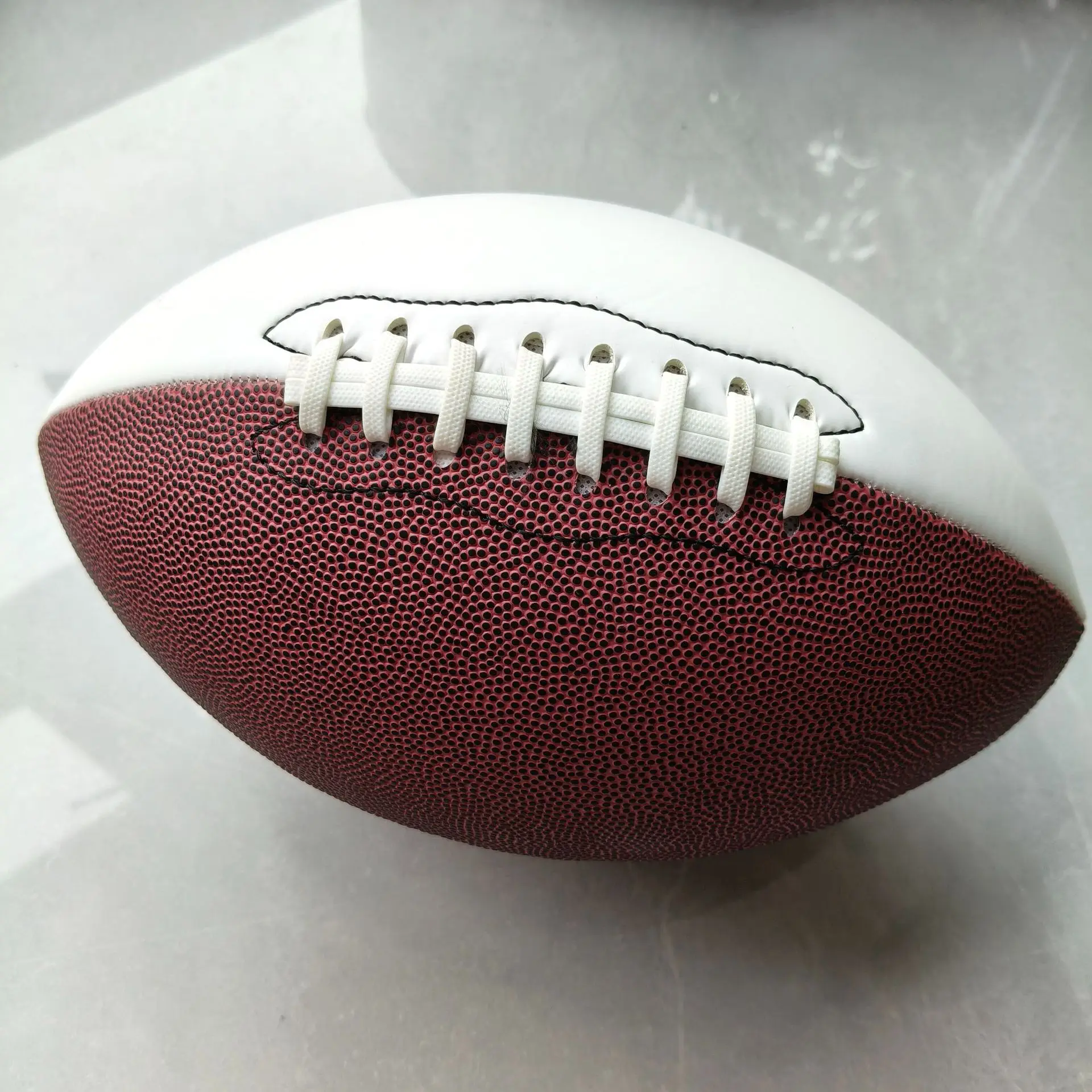 1Pcs American-Style Size 9 Pu Stitched Non-Slip Training Rugby Ball Suitable for Outdoor Use. Pu Stitching Technology Enhances Grip. Pu Material Suitable for Gyms, Playgrounds. Multiple Colors Available