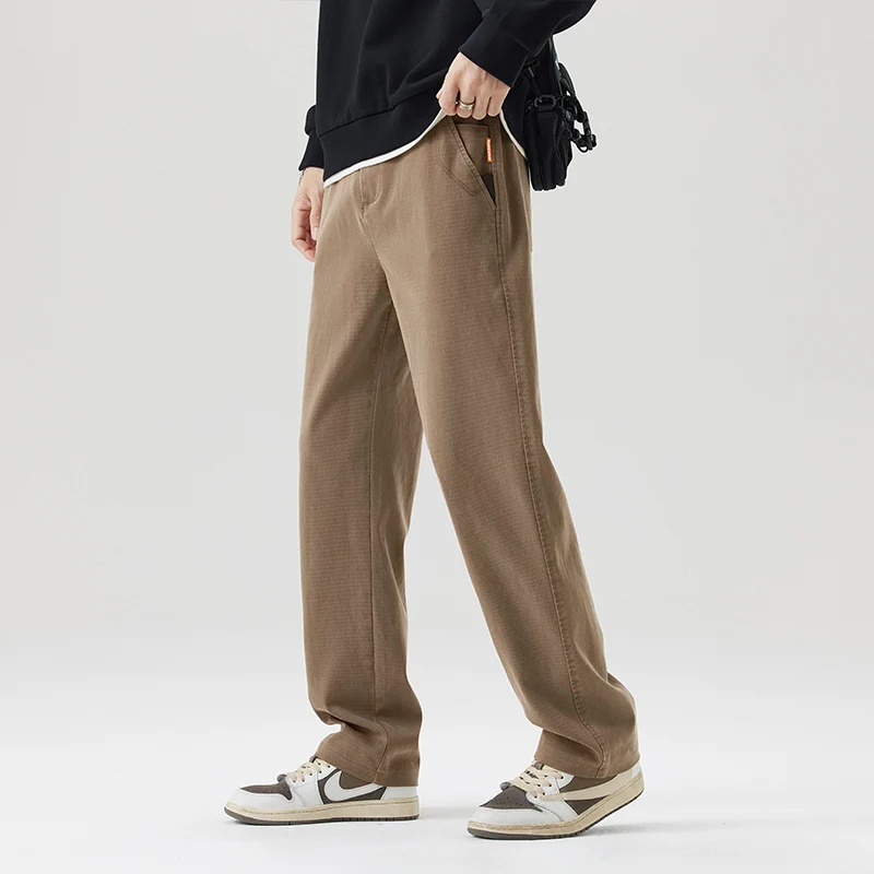 กางเกงขายาวทรงตรงหลวมผู้ชายผ้าไลโอเซลล์ รุ่นปี 2025 สำหรับฤดูใบไม้ร่วงและฤดูหนาว ผ้าพลิ้วสบาย ใส่ได้หลายโอกาส กางเกงลำลองไซส์ใหญ่พิเศษ 5XL