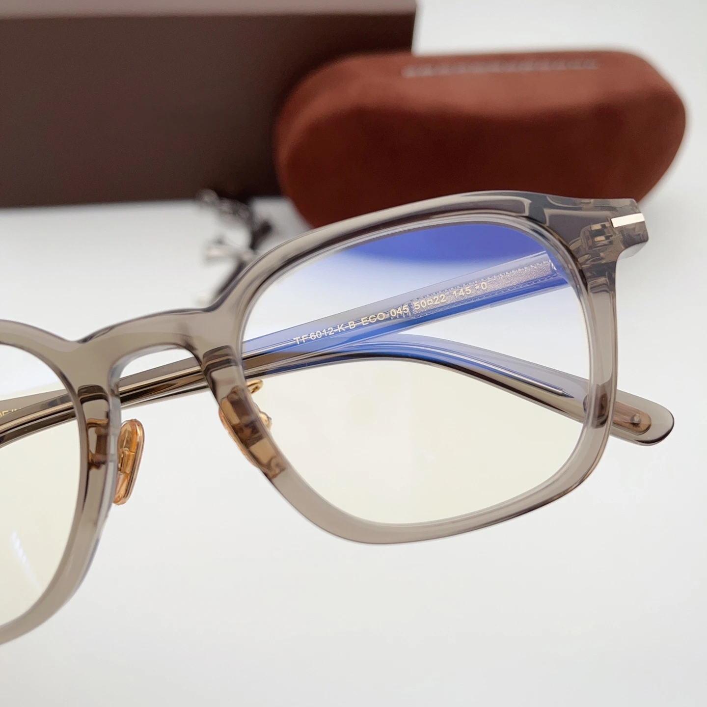 TF6012-K-B Man Woman Eyeglasses,Transparent Grey Frame Metal Accent,Adjustable Nose Pad,Create Refined Daily Commuter Look