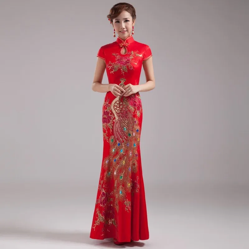 A fashion show in cheongsam featuring long Chinese style red improved welcoming etiquette attire for women