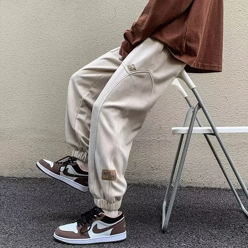 Pantaloni sportivi con applicazioni in pelle scamosciata casual autunnale per uomo Pantaloni da jogging con coulisse patchwork Pantaloni Harem larghi alla moda Hip Hop