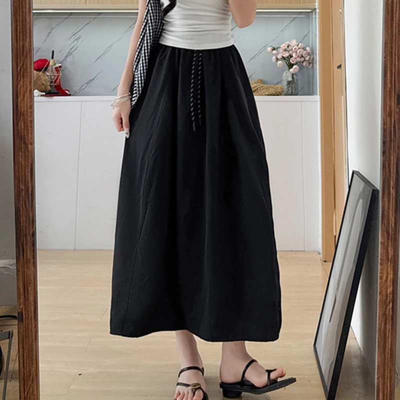 تنورة نسائية صيفية من الحرير الجليدي لعام 2025 بخصر مطاطي كوري تنانير طويلة على شكل حرف A للسيدات بأربطة ملابس خروج رفيعة تنانير نسائية