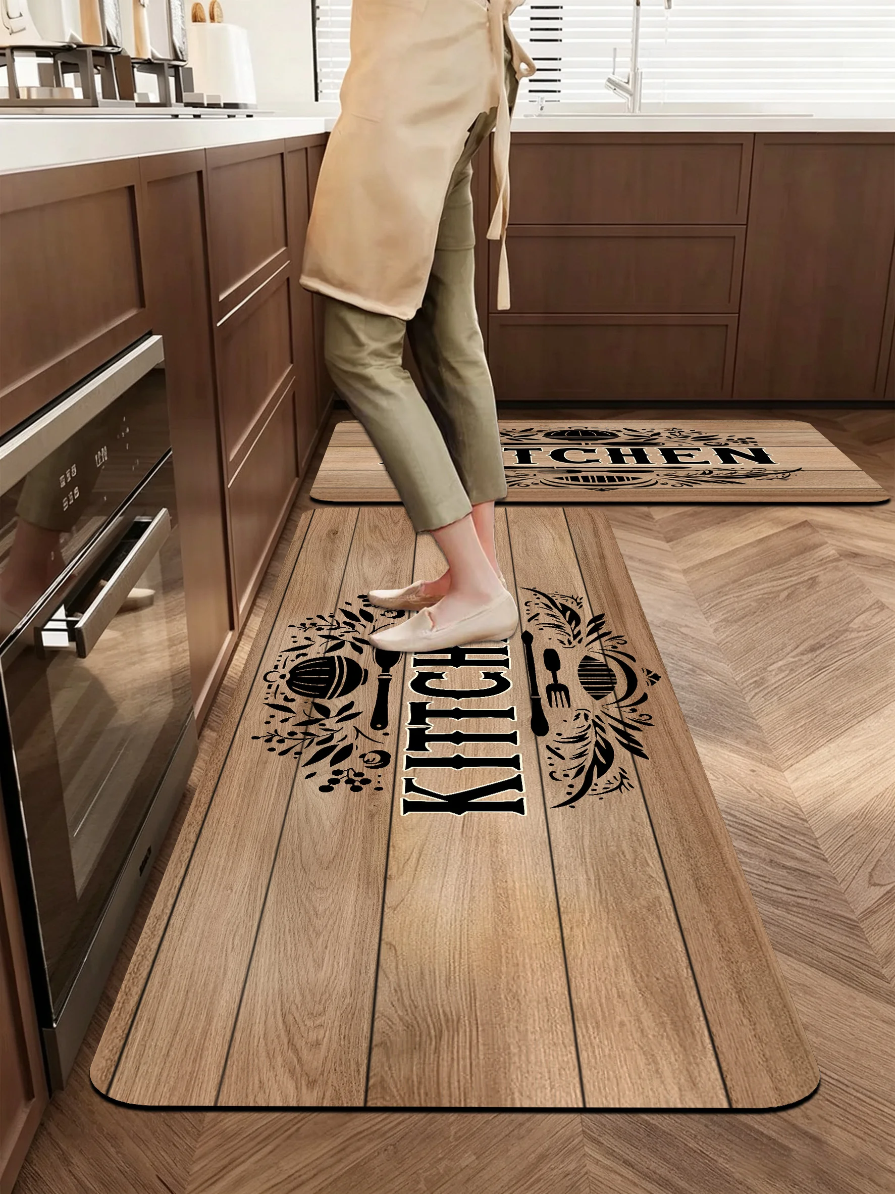New kitchen & bath rugs with vintage wood‑plank and kitchen letter‑utensil print. Slip‑resistant, absorbent & easy to clean.