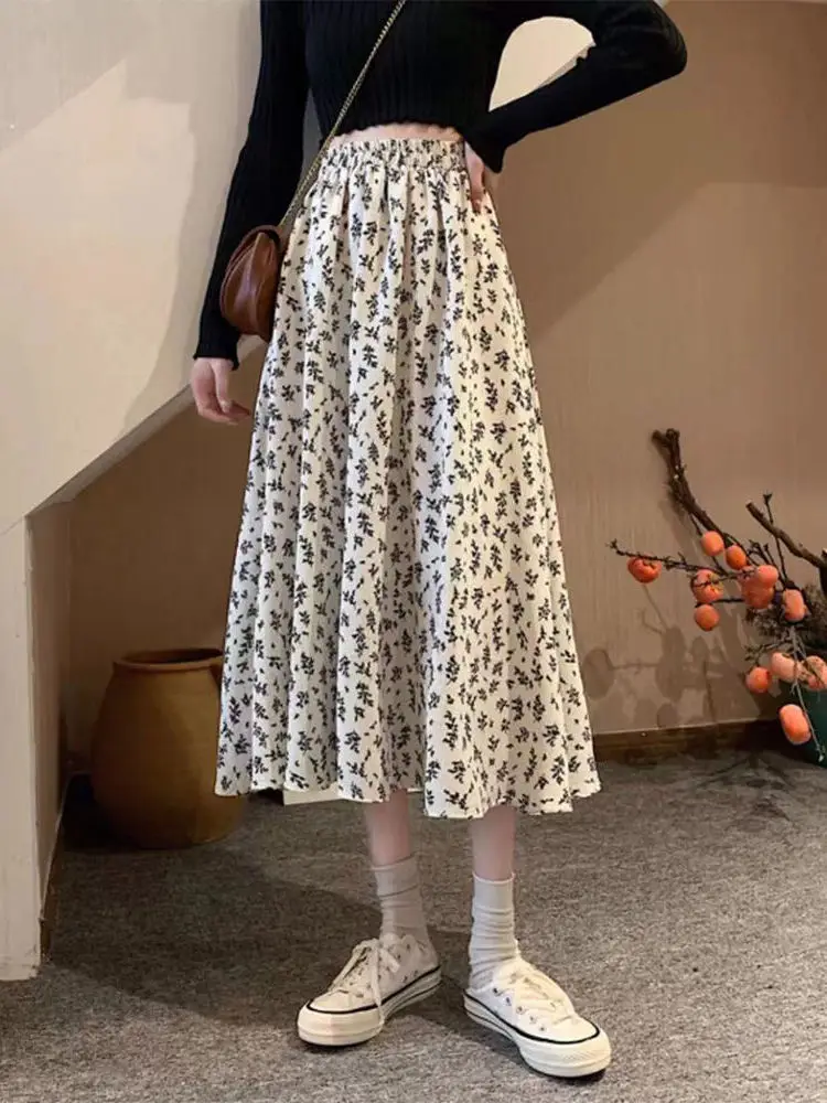 Spódnica midi w kwiatowy wzór plus size, rozkloszowana, wyszczuplająca, zakrywająca biodra, wiosenno-jesienna, damska, codzienna, z wysokim stanem, z włókna poliestrowego.