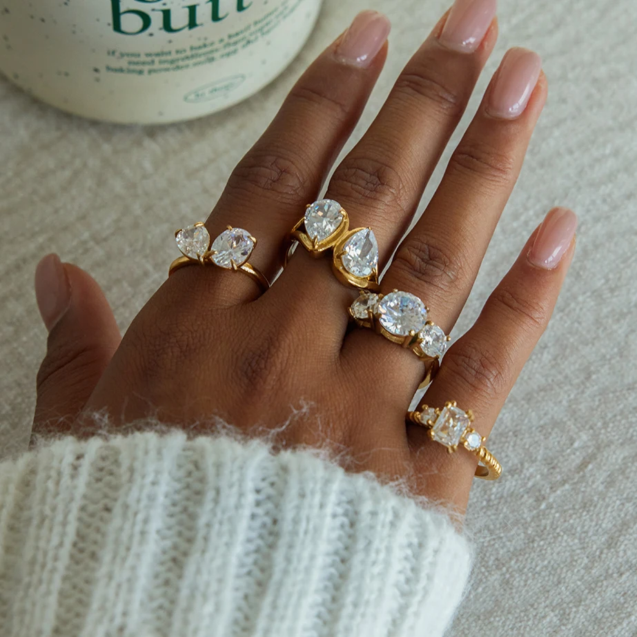 

AIKOER Classic MInimalist 18k Gold Color Plated Droplet Shaped Large White Zircon Rings Waterproof Stainless Steel Jewelry Gift
