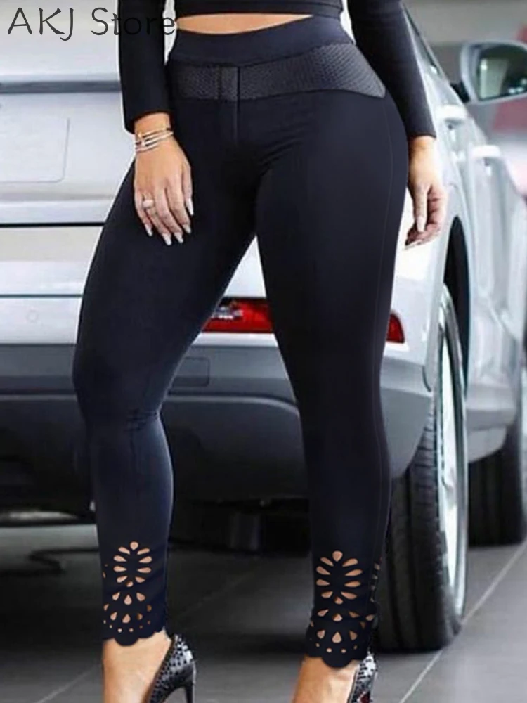 Bloemen uitgeholde skinny broek met asymmetrische zoom en elastische taille