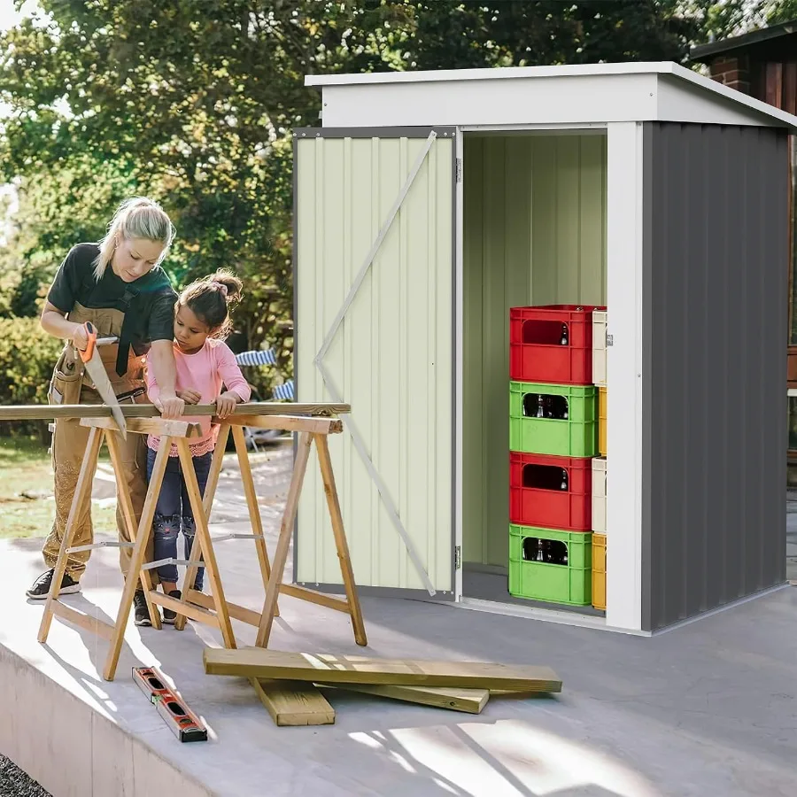 Outdoor storage shed for backyard patio use, made of metal, gray color, featuring single lockable door and weather-resistant de