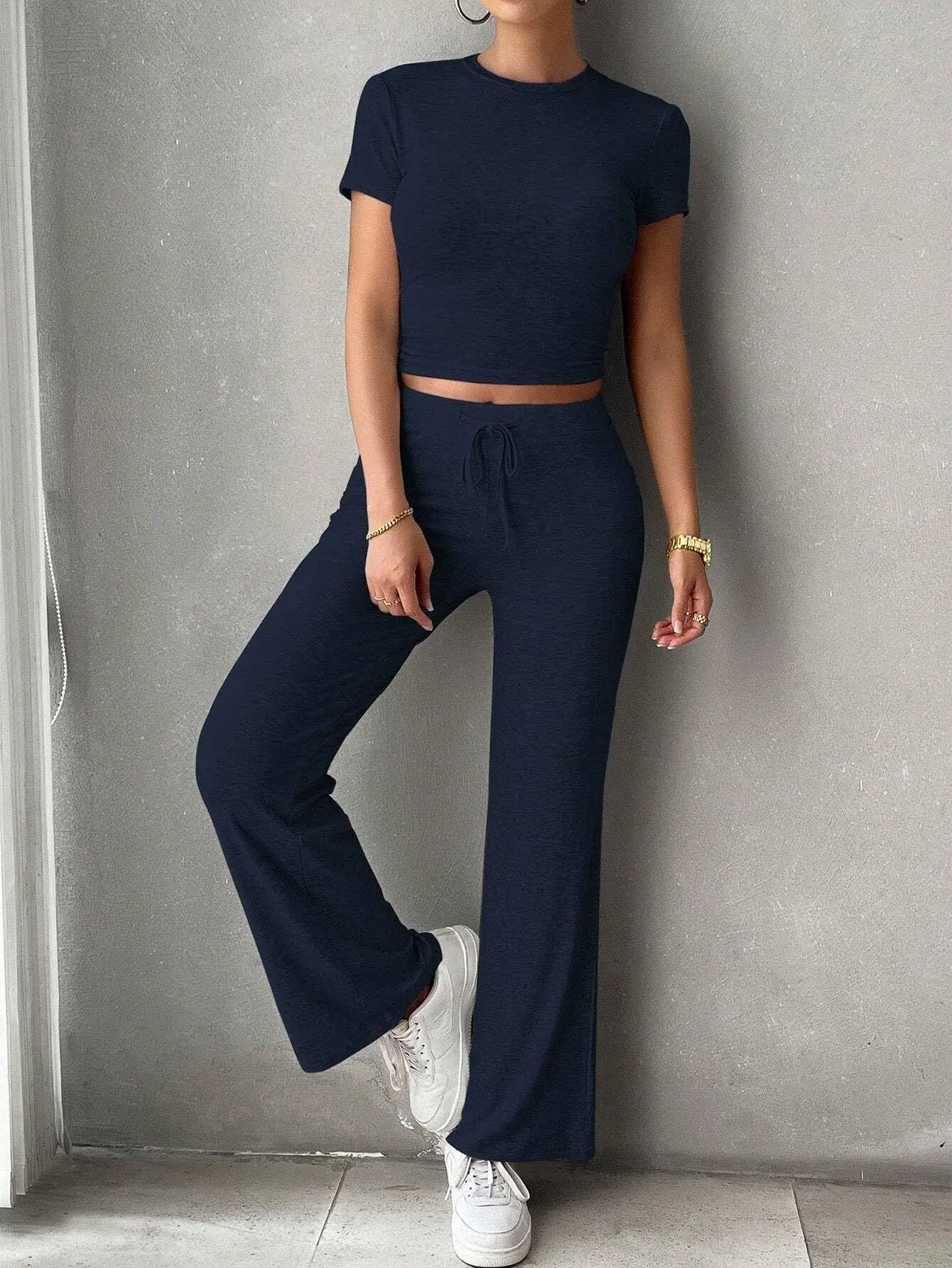 Nuova collezione estiva da donna Set solidi Spalla moda Manica corta Crop Top Set Pantaloni lunghi Set due pezzi Tute sportive per la casa