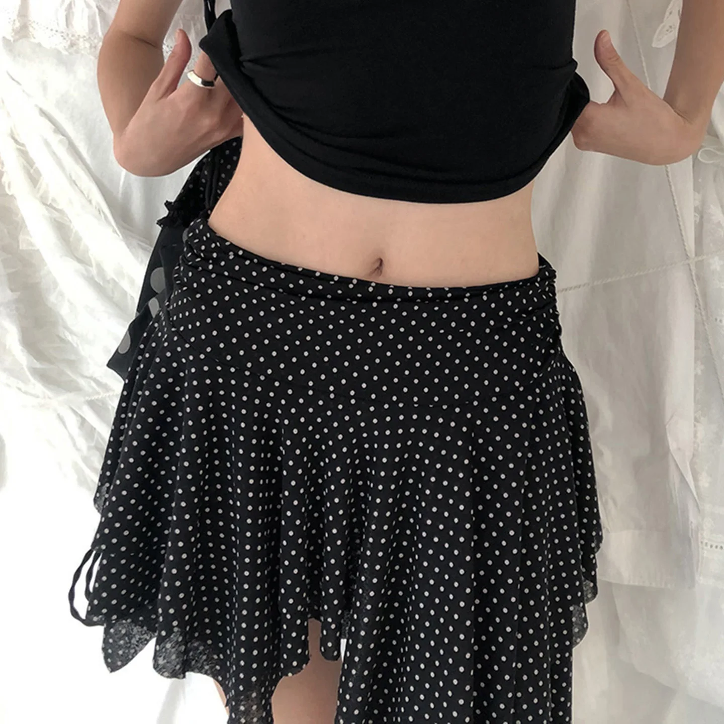 Europe and the United States dark polka-dot printed low-waisted skirt sexy slim mesh stitching irregular skirt in summer.