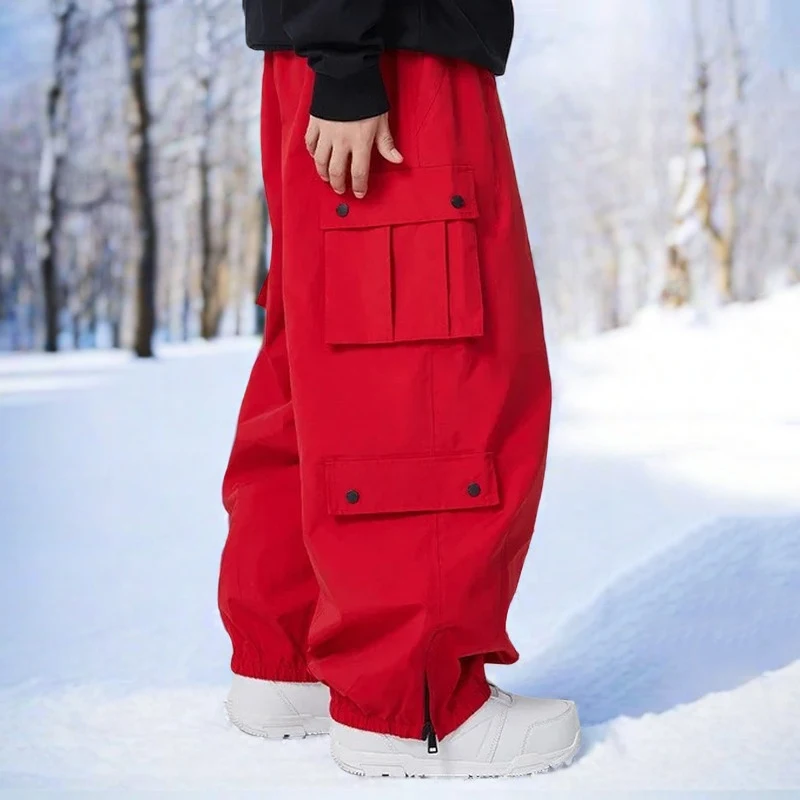 

Новые зимние уличные лыжные брюки мужские спортивные и досуговые ветрозащитные водонепроницаемые брюки женские однобортные свободные теплые дышащие зимние штаны