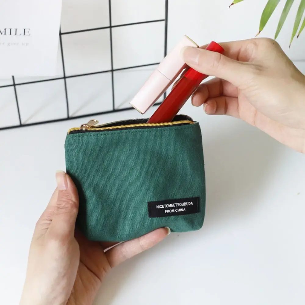 Mini monedero de estilo coreano para mujer, bolsa de cosméticos de lona de Color sólido, bolsa de servilleta sanitaria