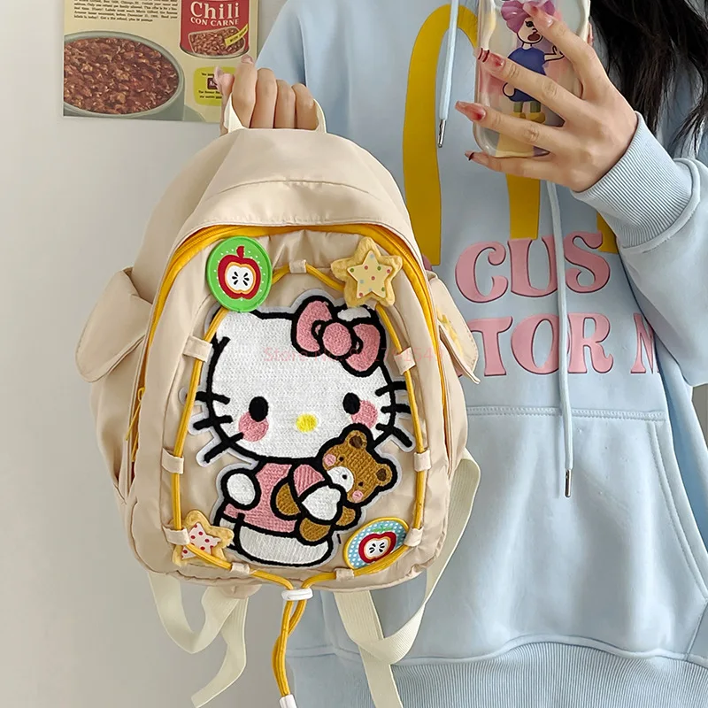 Mochila con estampado de Hello Kitty Sanrio, mochila para estudiantes a prueba de polvo, mochila de viaje multifuncional Simple, regalo de Navidad para niña