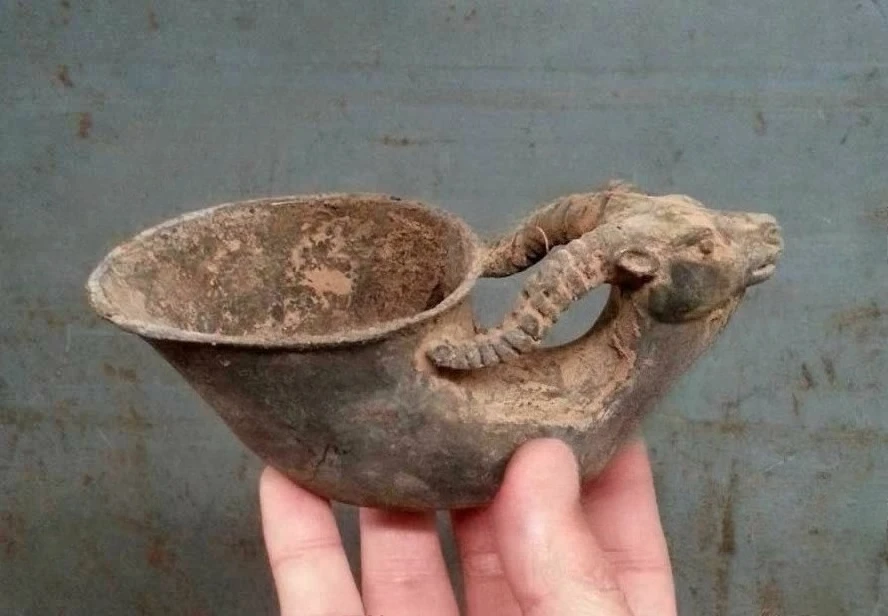 

ancient bronze libation cup with goat rams head Horn handle Signed Collectable