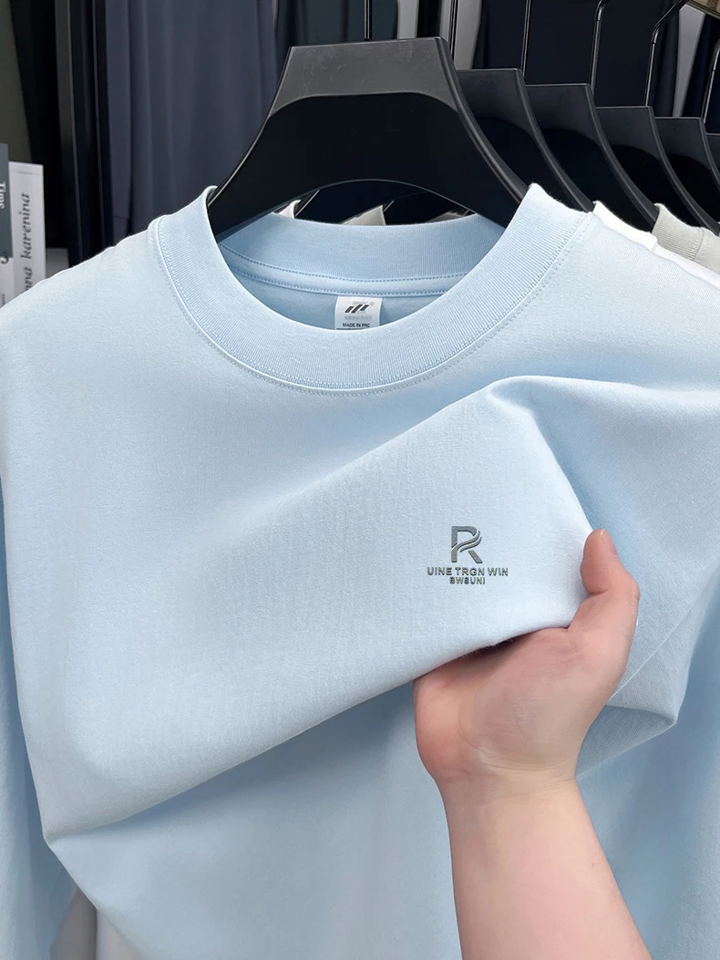 T-shirt a maniche lunghe da uomo in puro cotone di fascia alta 2025 Nuova primavera e autunno inverno girocollo allentato con cappuccio tinta unita da uomo