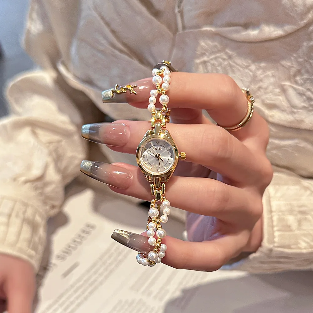 

Elegant new women's watch with pearl chain light luxury elegant and gentle exquisite bracelet watch delicate ladies' wristwatch.
