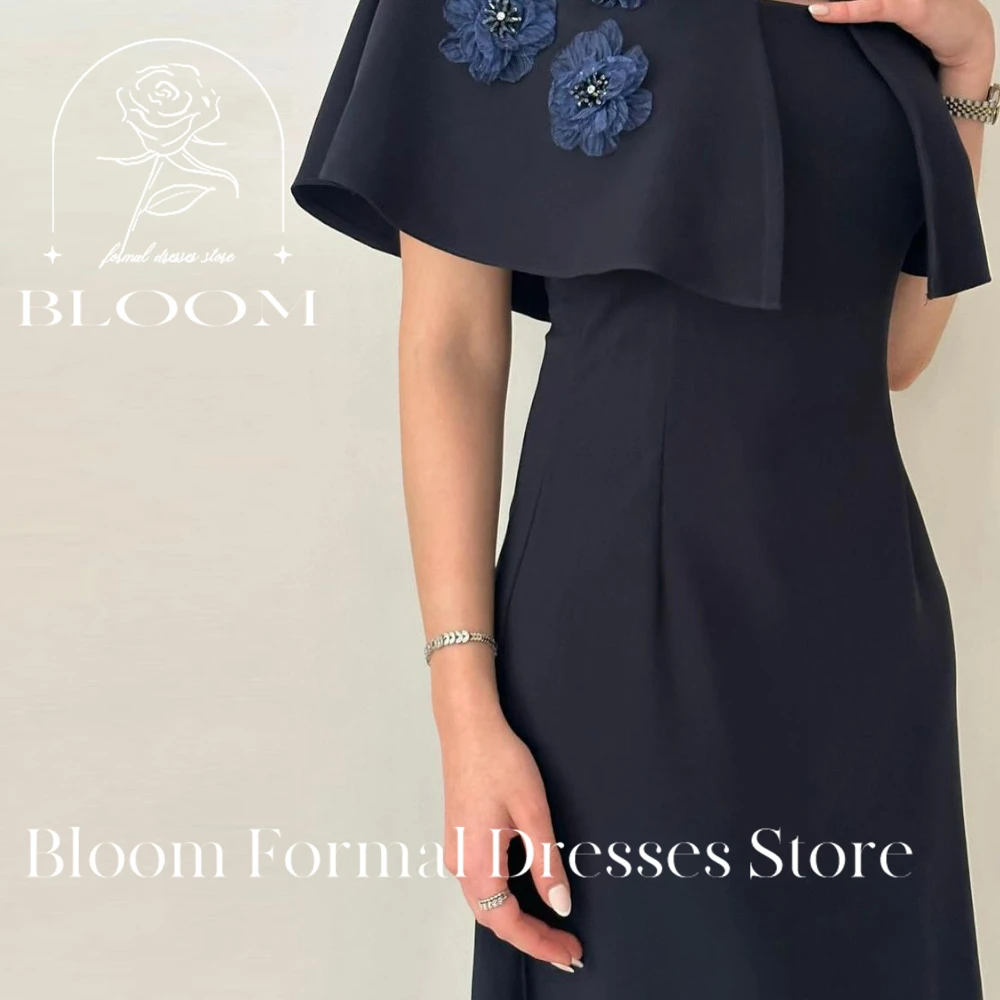 Bloom Customized Sophisticated Navy Blue Dress features a unique cape detail with decorative blue flowers. The straight neckline