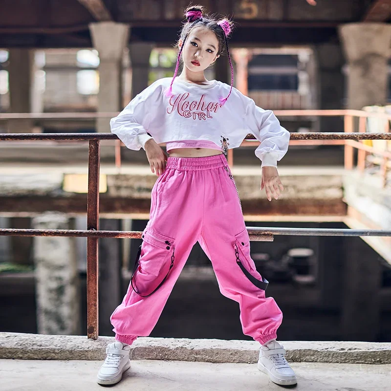 Disfraz de espectáculo de práctica de baile callejero para niños, ropa de baile de Jazz moderno, Tops de manga larga blancos para niñas, pantalones rosas sueltos de Hip Hop