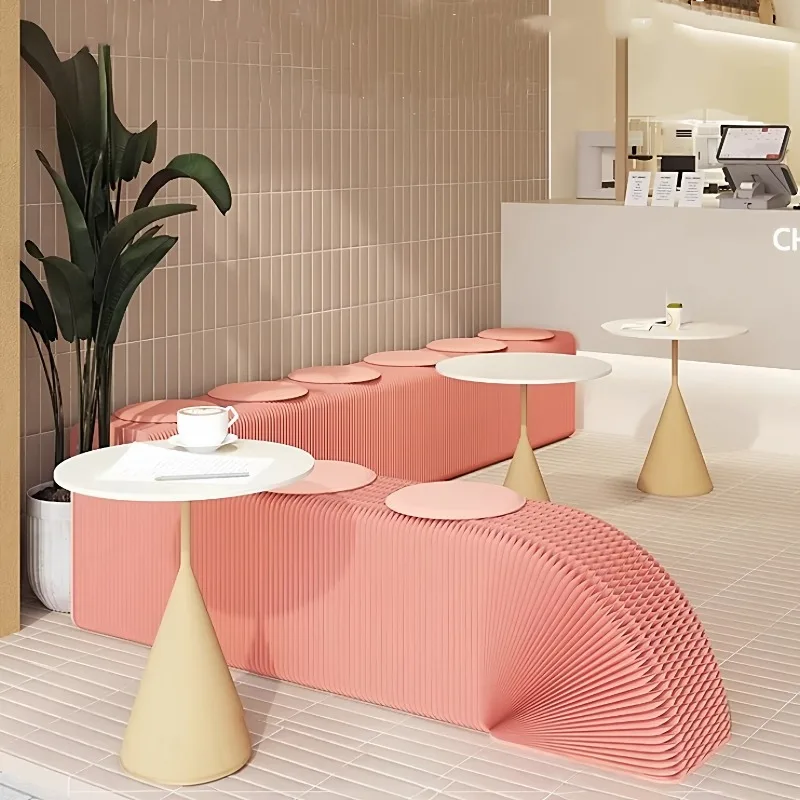 Pink paper folding bench multi-seat stool queuing waiting for a pop-up store creative fashion exhibition event
