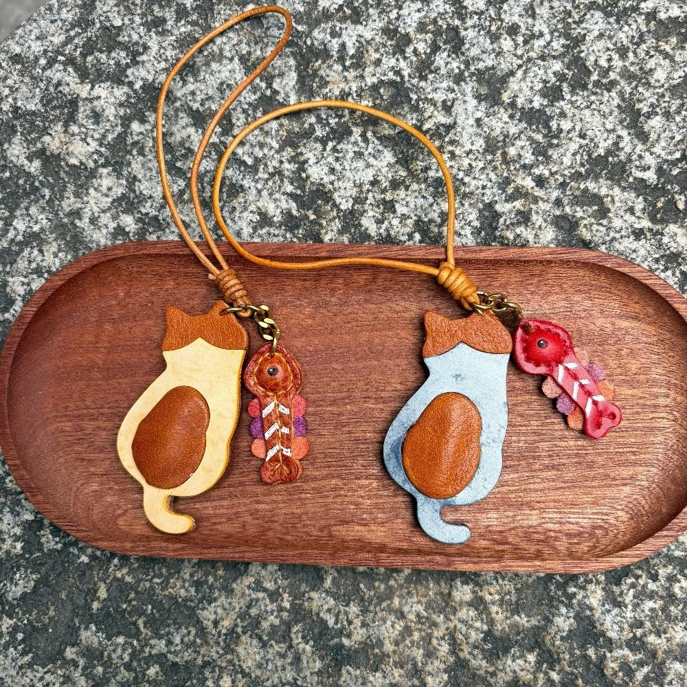 

Genuine leather cat bag charm cute cat pendant, bag accessory backpack charm cat eating fish bag charm