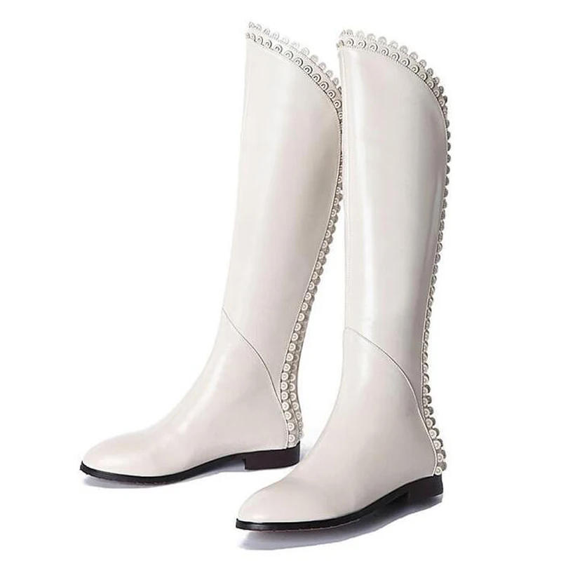 

Зимние модные сапоги до колена на плоской подошве с круглым цветком, белые, черные кожаные сапоги с неровным отверстием, женские длинные сапоги с острым носком