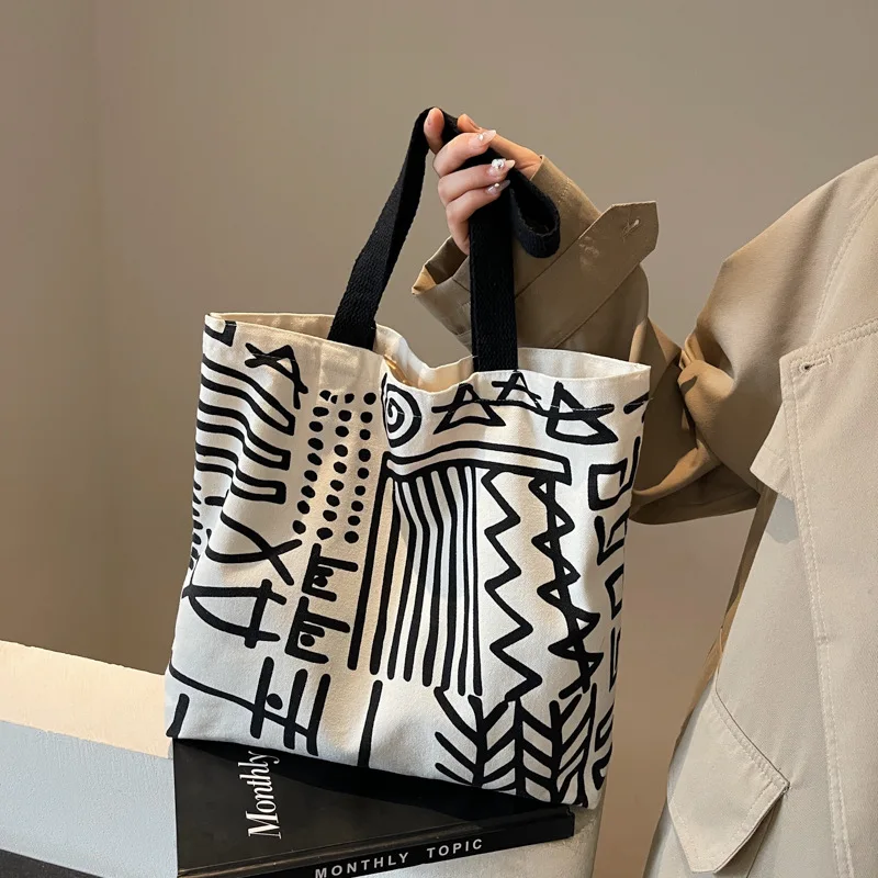 ファッションプリントストライプキャンバスバッグ、大容量裏地ハンドバッグ、キャンパス学生バックパック、若者の日常ショッピング文学用途