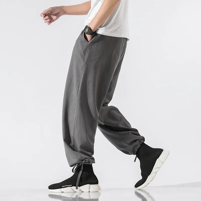 Plus größe Männer Jogger baumwolle Leinen Hosen Männer Lose Beiläufige Elastische taille Schwarz Grau weiß street Hosen große größe 5XL 6XL 7XL