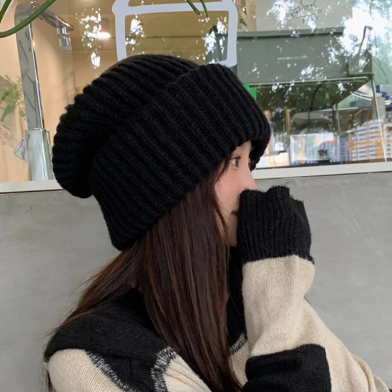 Neue Winter Warme Gestrickte Stapelbare Mütze Damen Koreanische Mode Einfarbig Outdoor Winddichte Pullover-Mütze Ohrenschutz Lose Mütze