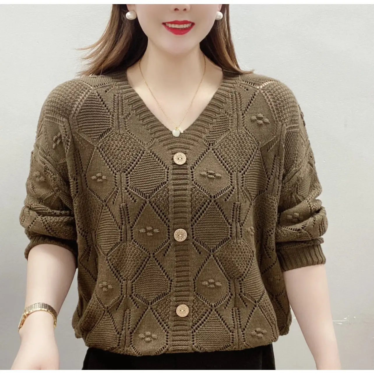 

Spring And Autumn New Knitted Sweater Women's Casual Loose Hollow V-neck Sweater Fashion Long Sleeve Top