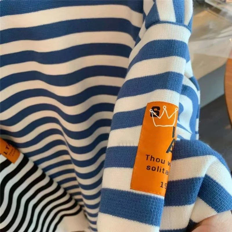 เสื้อยืดลายทางทรงหลวมสไตล์เกาหลี แขนยาว ใส่สบาย ทรงเข้ารูป แฟชั่นอเนกประสงค์ เหมาะสำหรับฤดูใบไม้ผลิและฤดูใบไม้ร่วง