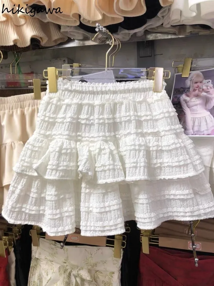 Falda acampanada De cintura alta para Mujer, minifalda japonesa con pliegues De encaje, color blanco, a la Moda, verano, 2024