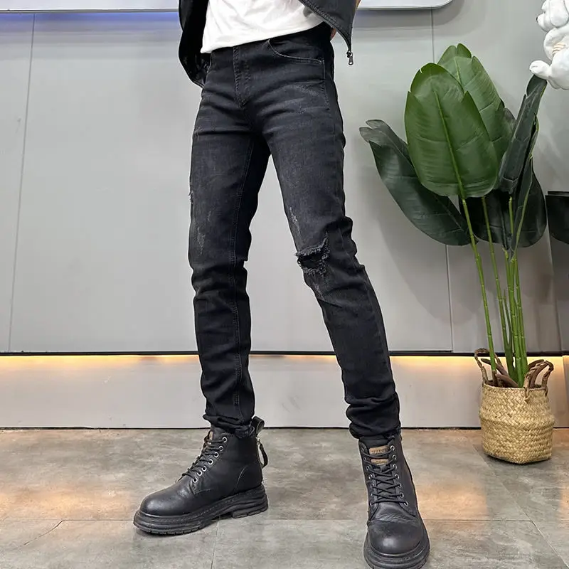 カウボーイデニムブラックフェイクリップドジーンズメンズトレンドブランド秋冬2025新作ファッショナブルな伸縮性スリムスキニージーンズパンツ男性用